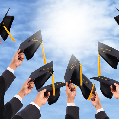 Graduation caps in hands of graduates 