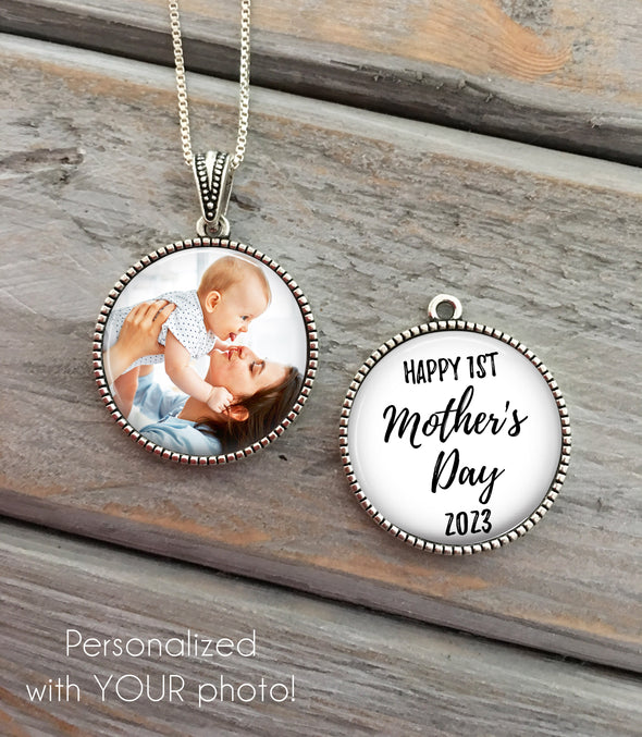 double side necklace with a photo of a mom holding her baby in the air and says Happy 1st Mother's Day