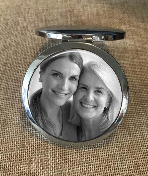 black and white photo on a purse mirror